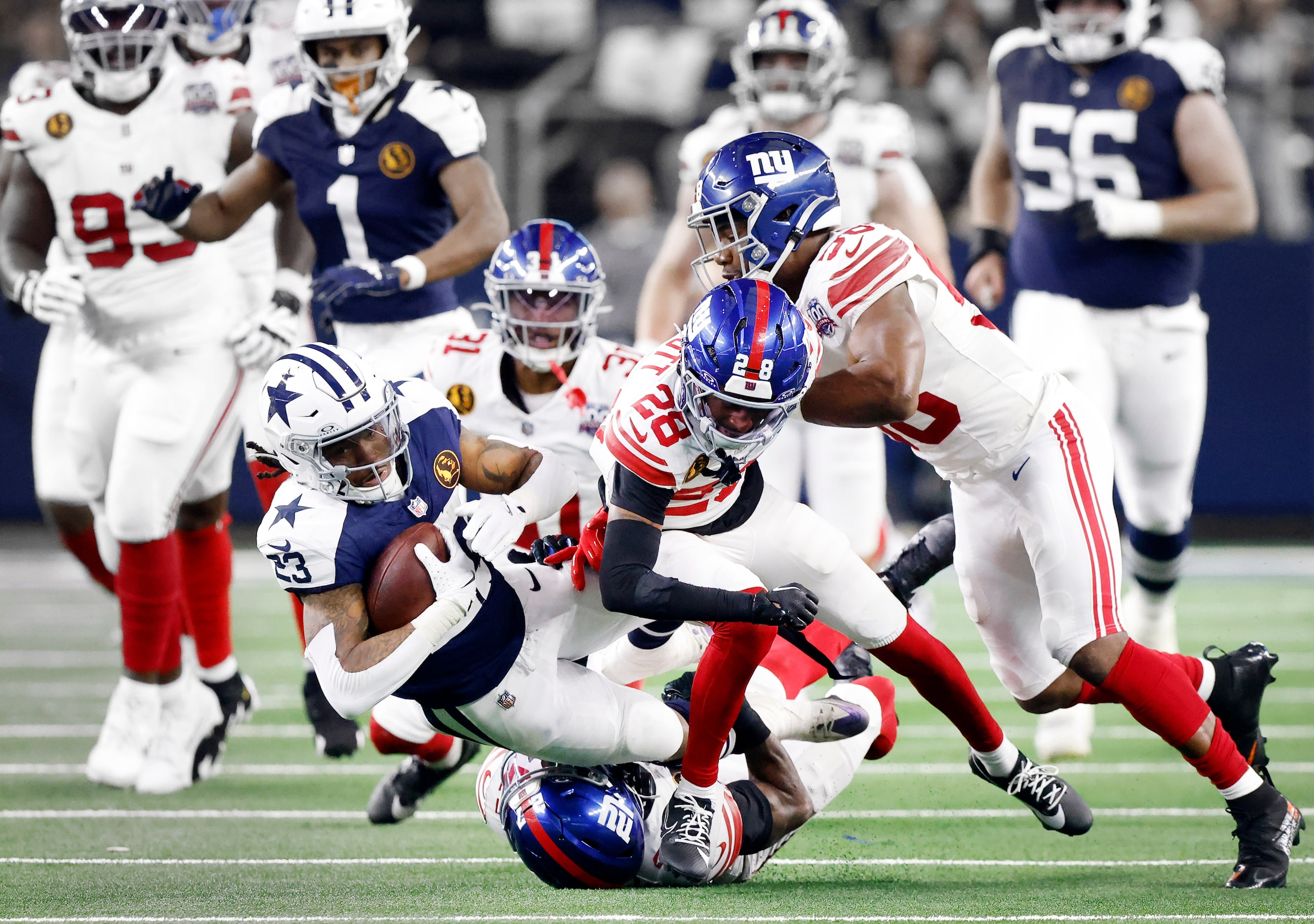 Dallas Cowboys running back Rico Dowdle (23) is finally taken down by New York Giants...