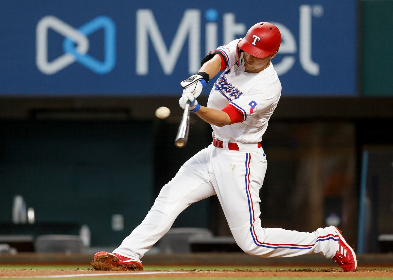 Texas Rangers shortstop Corey Seager (5) hits a two-run home run during the first inning of...