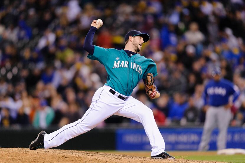 Apr 25, 2014; Seattle, WA, USA; Seattle Mariners relief pitcher Dominic Leone (52) pitches...