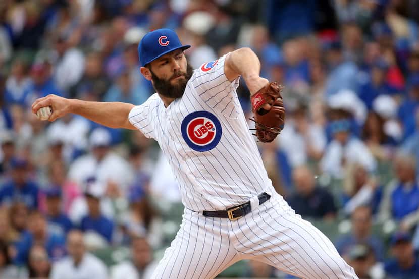 Chicago Cubs starting pitcher Jake Arrieta (49) delivers to the Milwaukee Brewers in the...