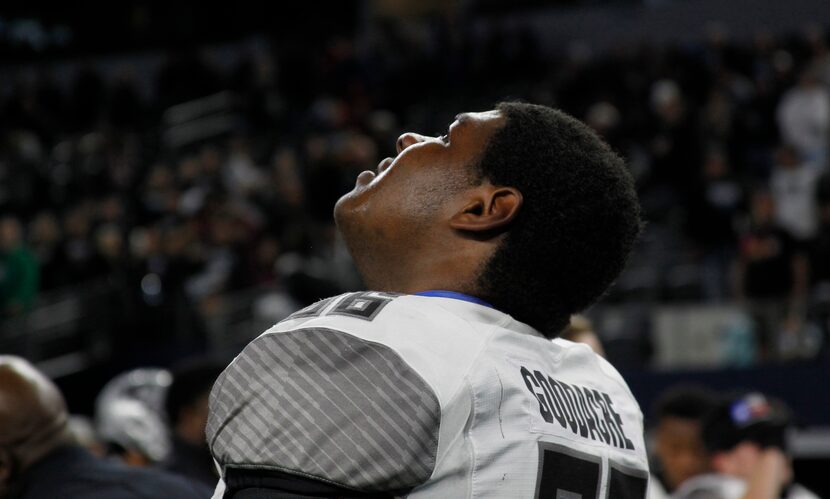 Denton Guyer's Willie Goodacre (66) looks upward to the overhead screen following the team's...