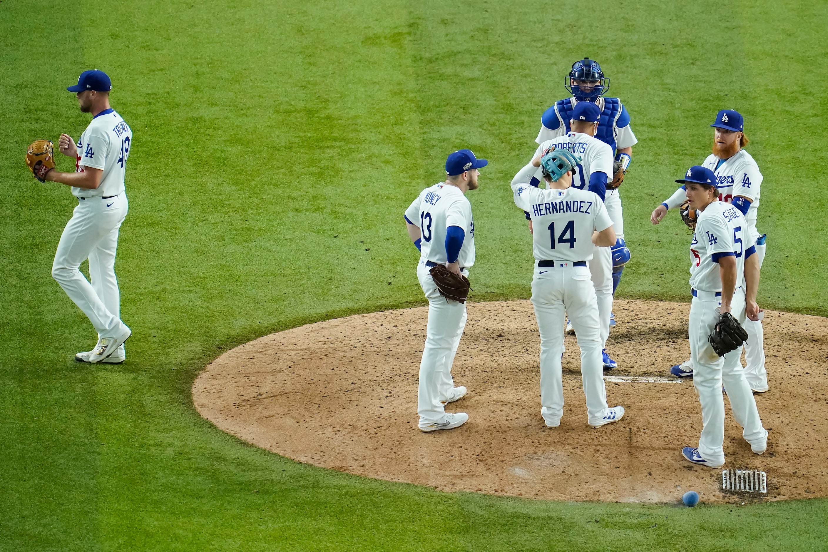 Los Angeles Dodgers relief pitcher Blake Treinen (49) leaves the game after giving up a run...