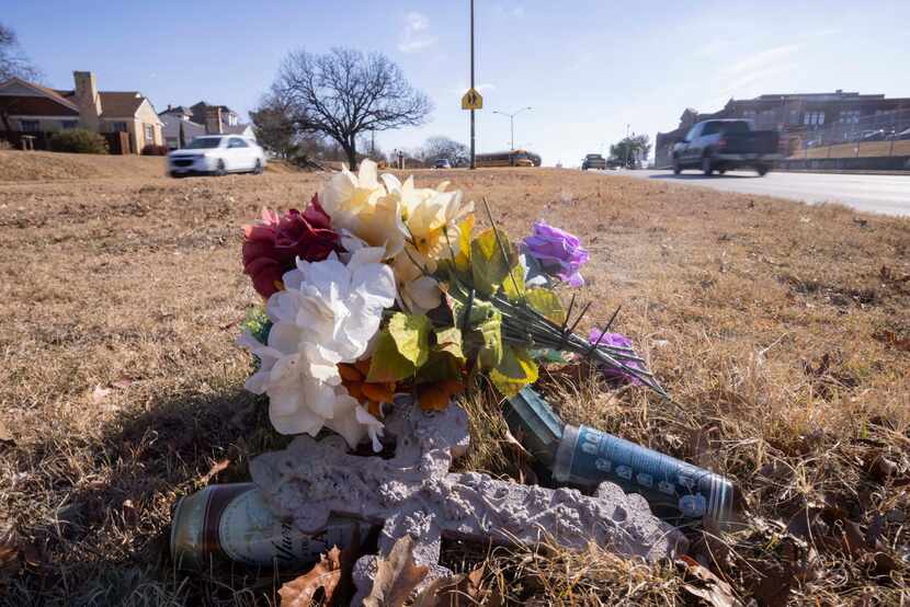 A memorial in the median of West Jefferson Boulevard near Sunset High School marks the site...
