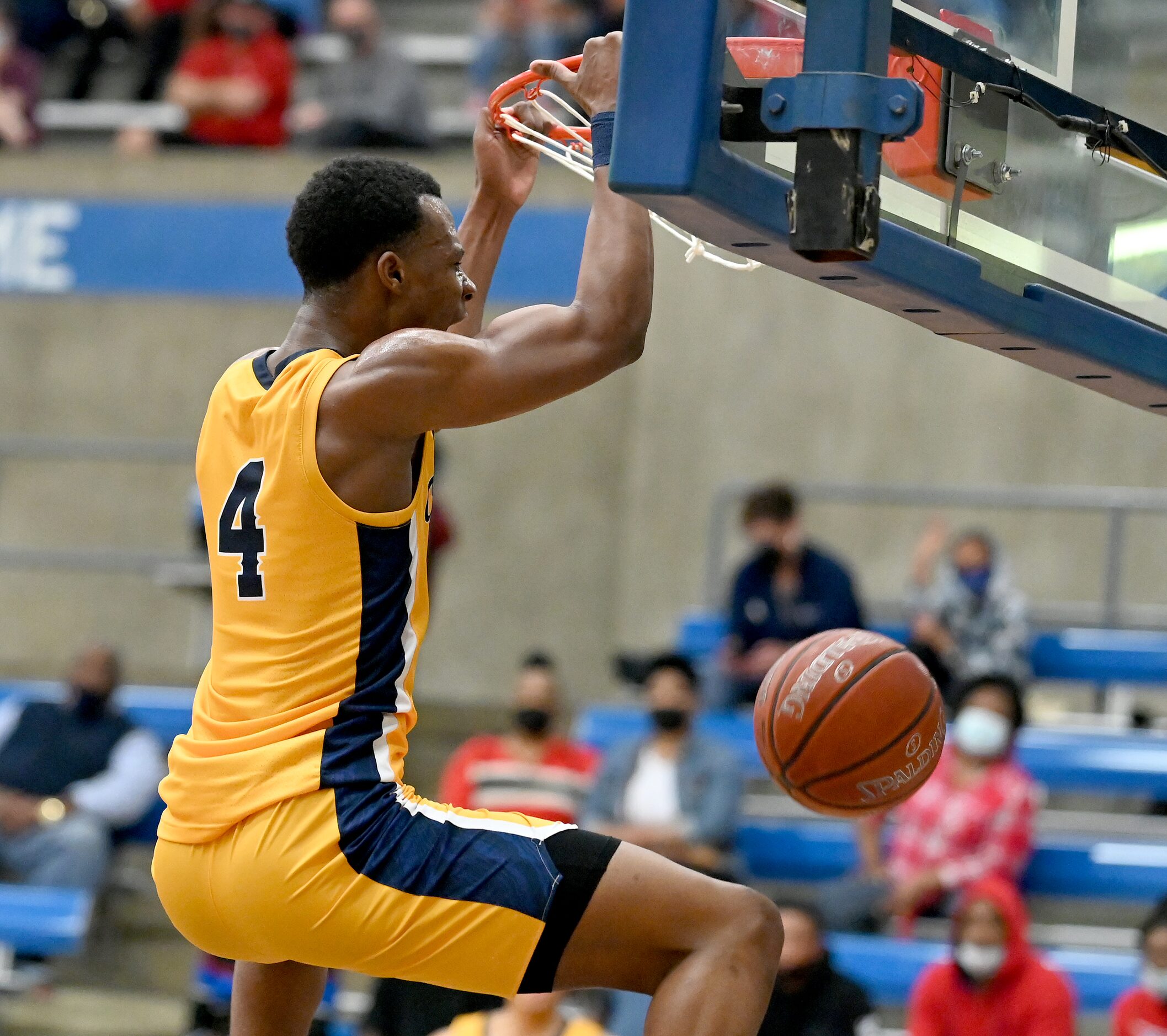 Faith Family’s T.J. Caldwell reacts after a dunk in the second half during a Class 4A Region...