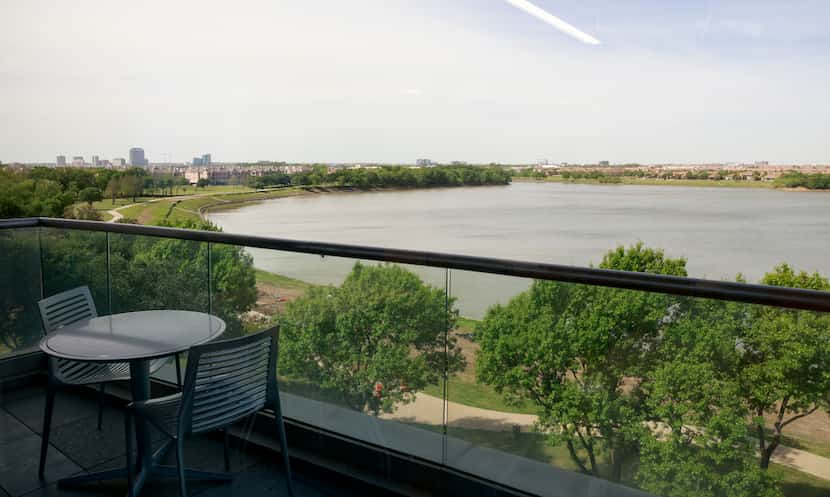 Workers at the PNC Tech Hub office can eat outside at tables that overlook the Elm Fork of...