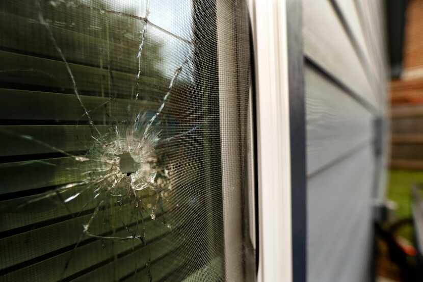 A bullet hole is seen in the rear window of Atatiana Jefferson's home in Fort Worth on Oct....