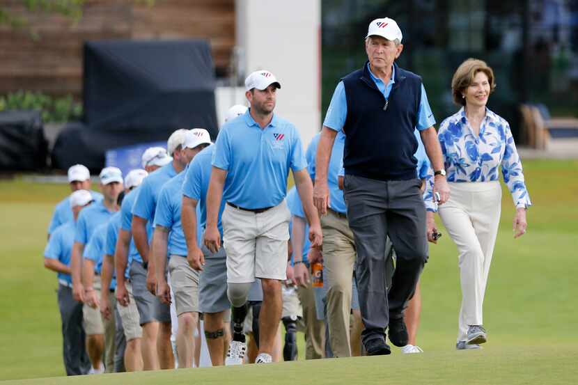 George W. Bush, 43rd President of the United States, walks towards the 18th green with...