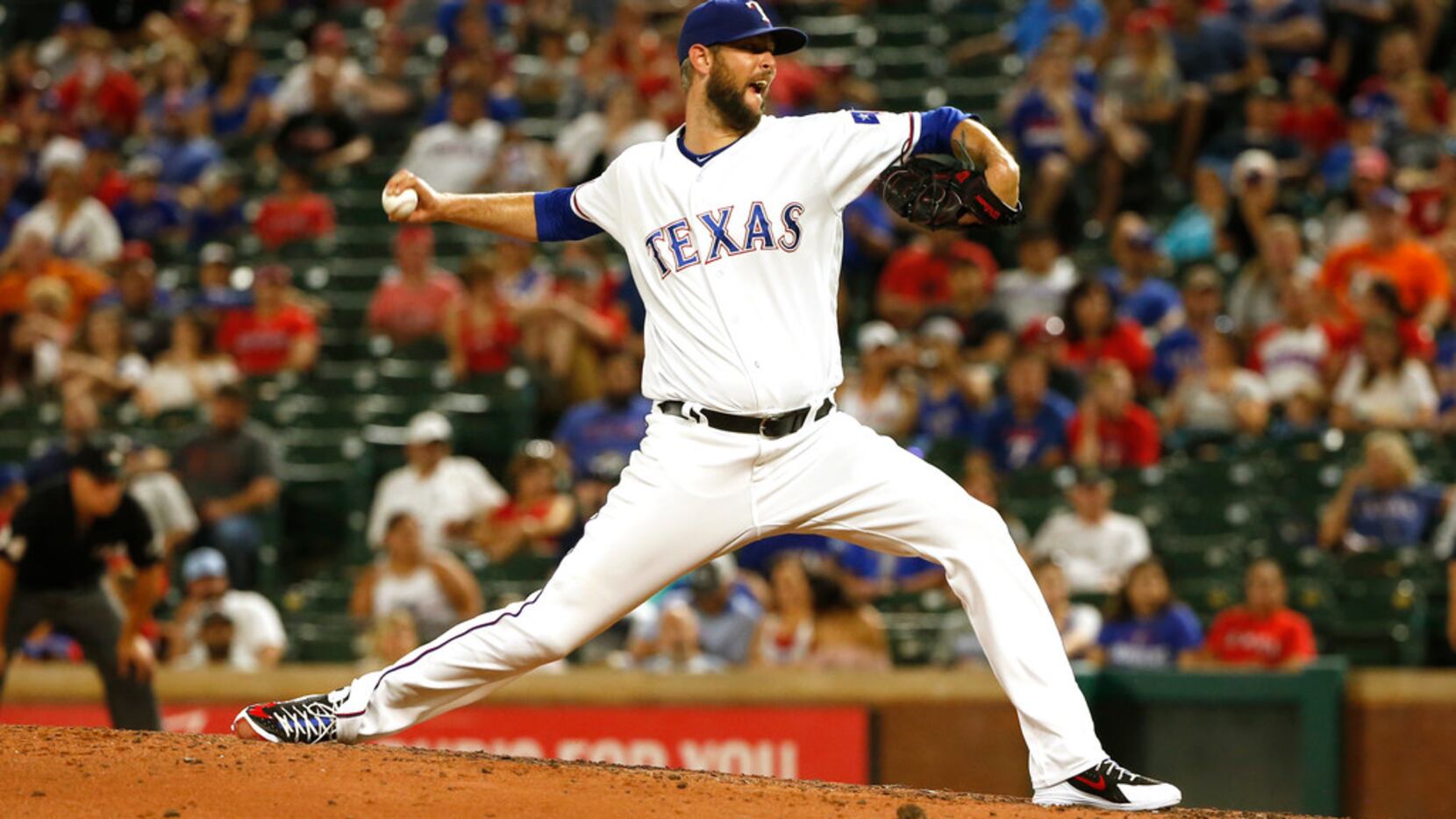Texas Rangers relief pitcher Chris Martin (31) throws against the San Diego Padres of a...