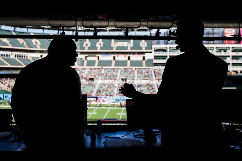 FOX Sports broadcasters Curt Menefee (left) and Joel Klatt call an XFL game between the...