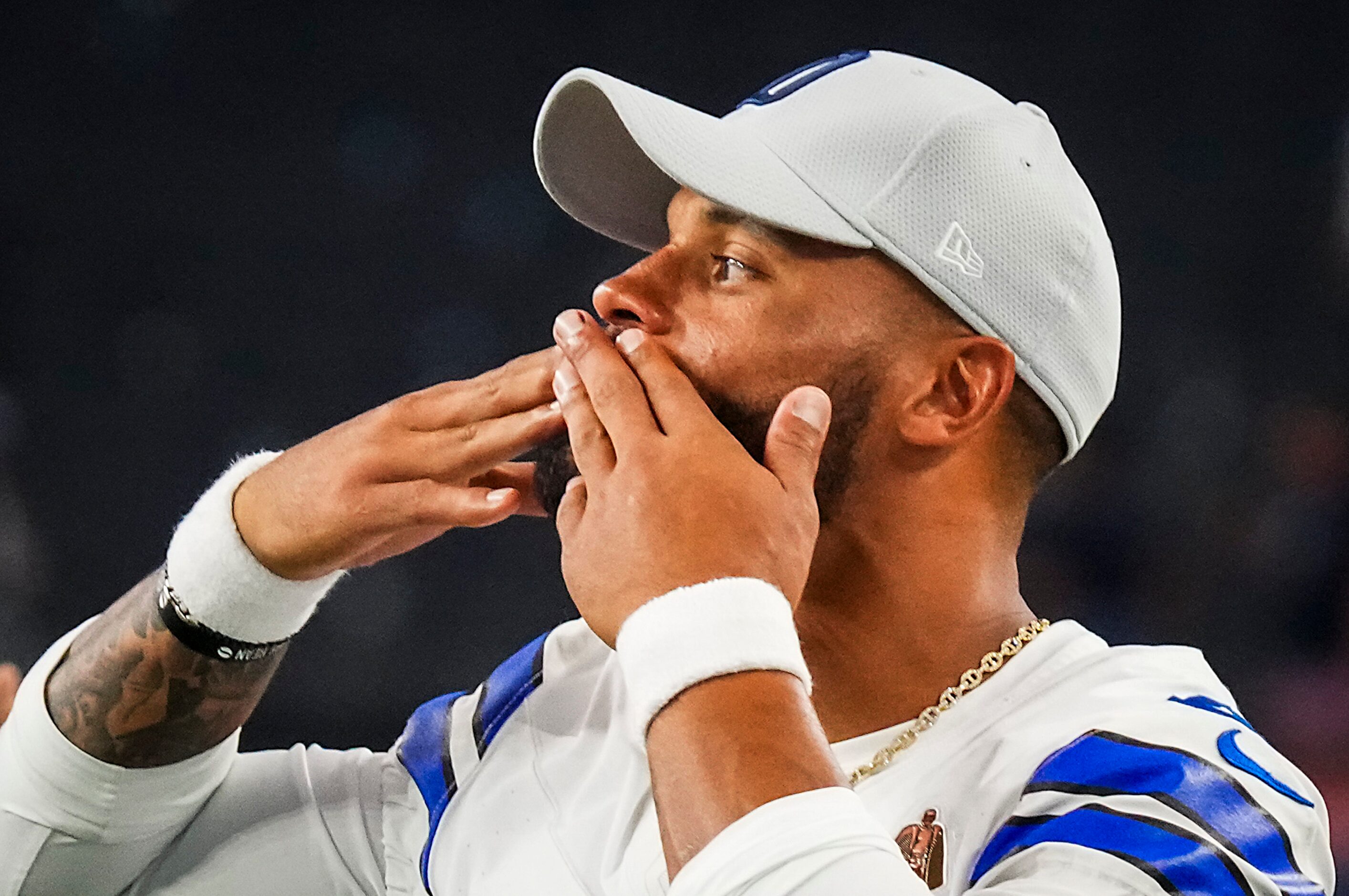 Dallas Cowboys quarterback Dak Prescott blows kisses to the crowd after an NFL preseason...