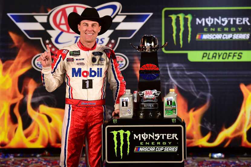 FORT WORTH, TX - NOVEMBER 04:  Kevin Harvick, driver of the #4 Mobil 1 Ford, poses with the...