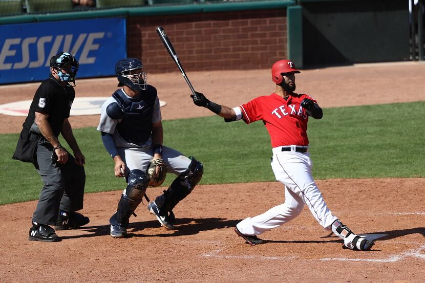ARLINGTON, TX - MAY 09:  Nomar Mazara #30 of the Texas Rangers hits a walk off homerun in...