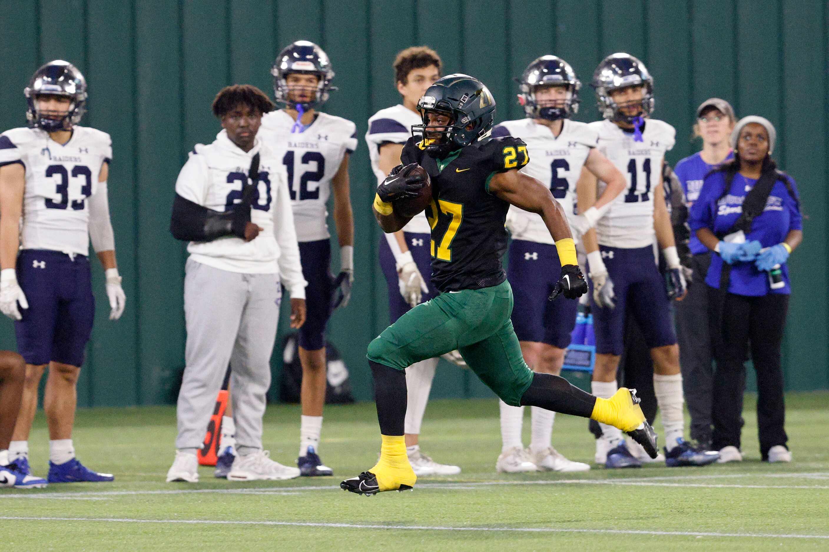 DeSoto's Marvin Duffey (27) runs into the end zone for a touchdown as Wylie East players...