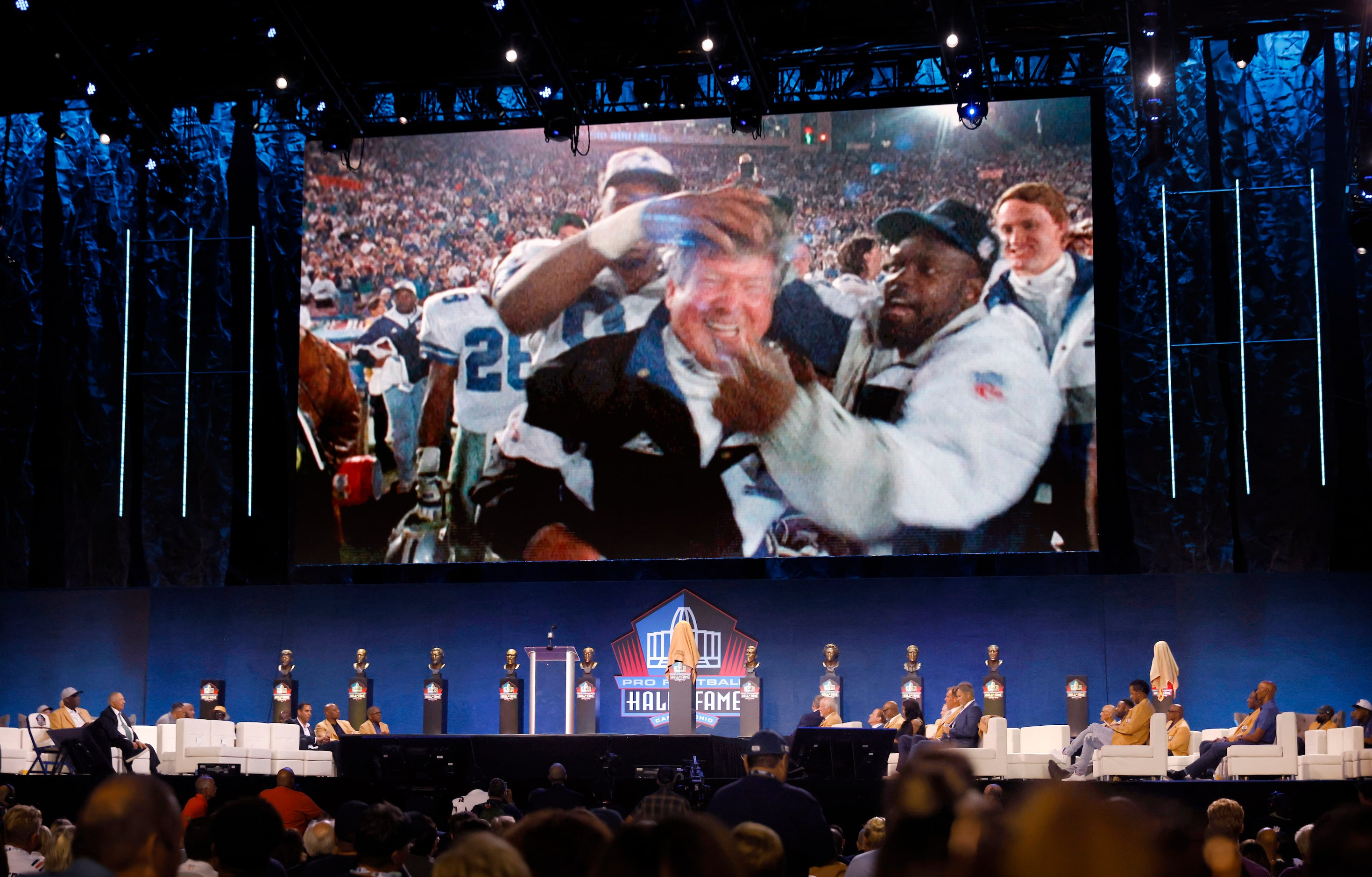 Photos of Pro Football Hall of Fame inductee Jimmy Johnson of the Dallas Cowboys celebrating...