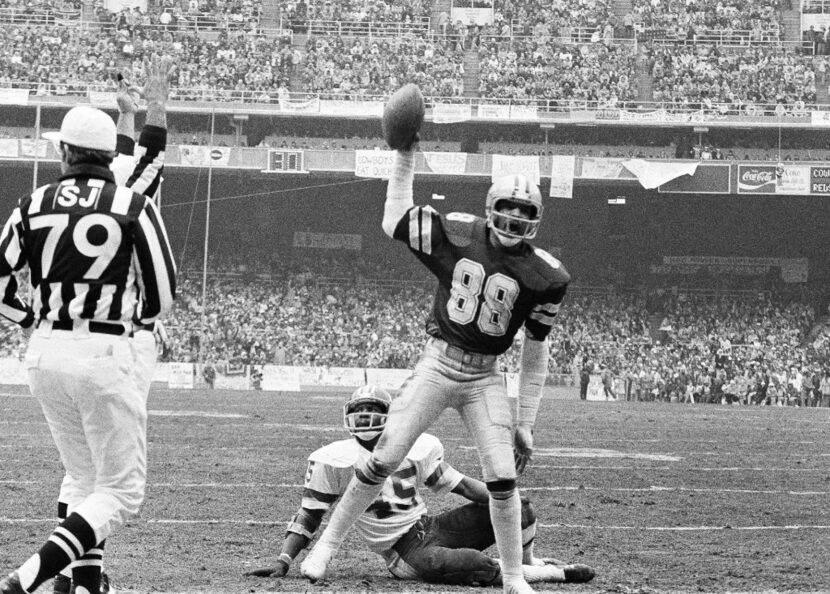 Drew Pearson (88) of the Dallas Cowboys holds the ball after scoring their first touchdown...