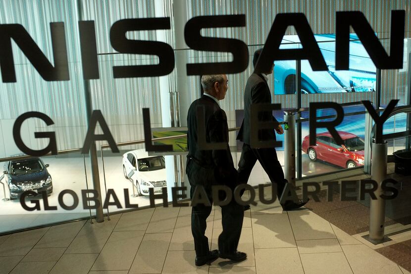 Visitors walk in Nissan gallery at its global headquarters in Yokohama, near Tokyo, Monday,...