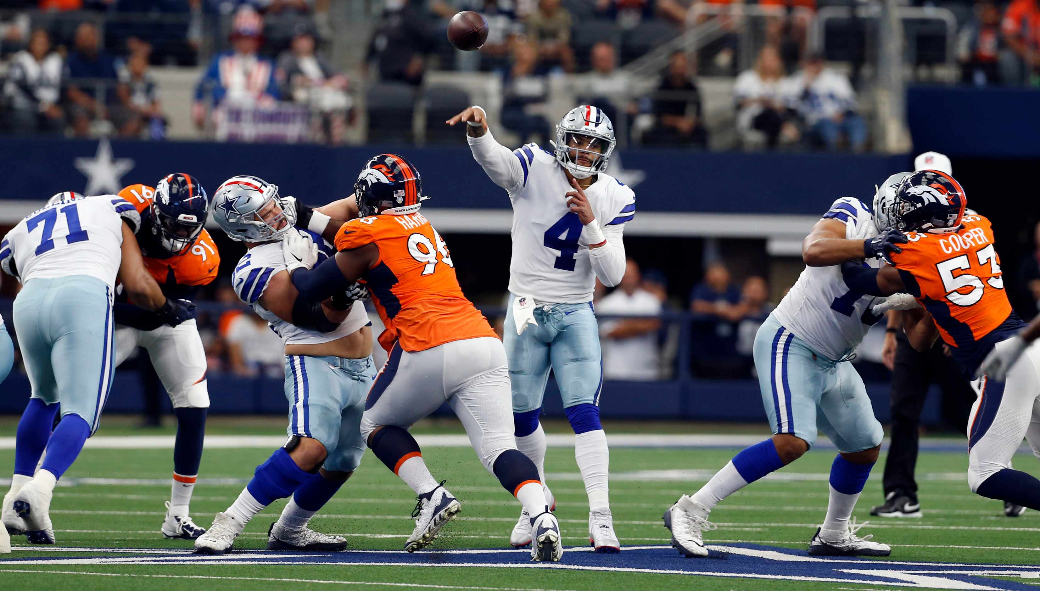 Dallas Cowboys quarterback Dak Prescott (4) throws a pass, as linemen try to give hime...
