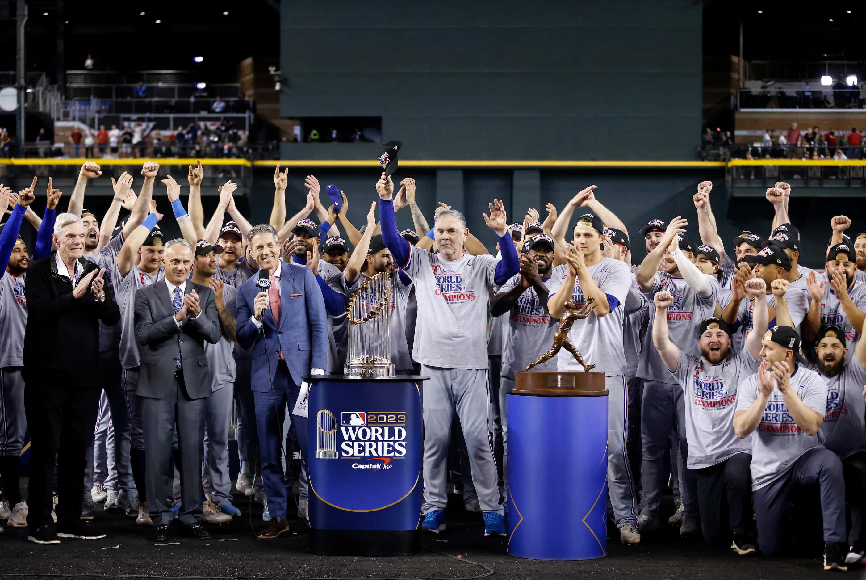 The Texas Rangers baseball team is introduced as World Series Champions during a postgame...