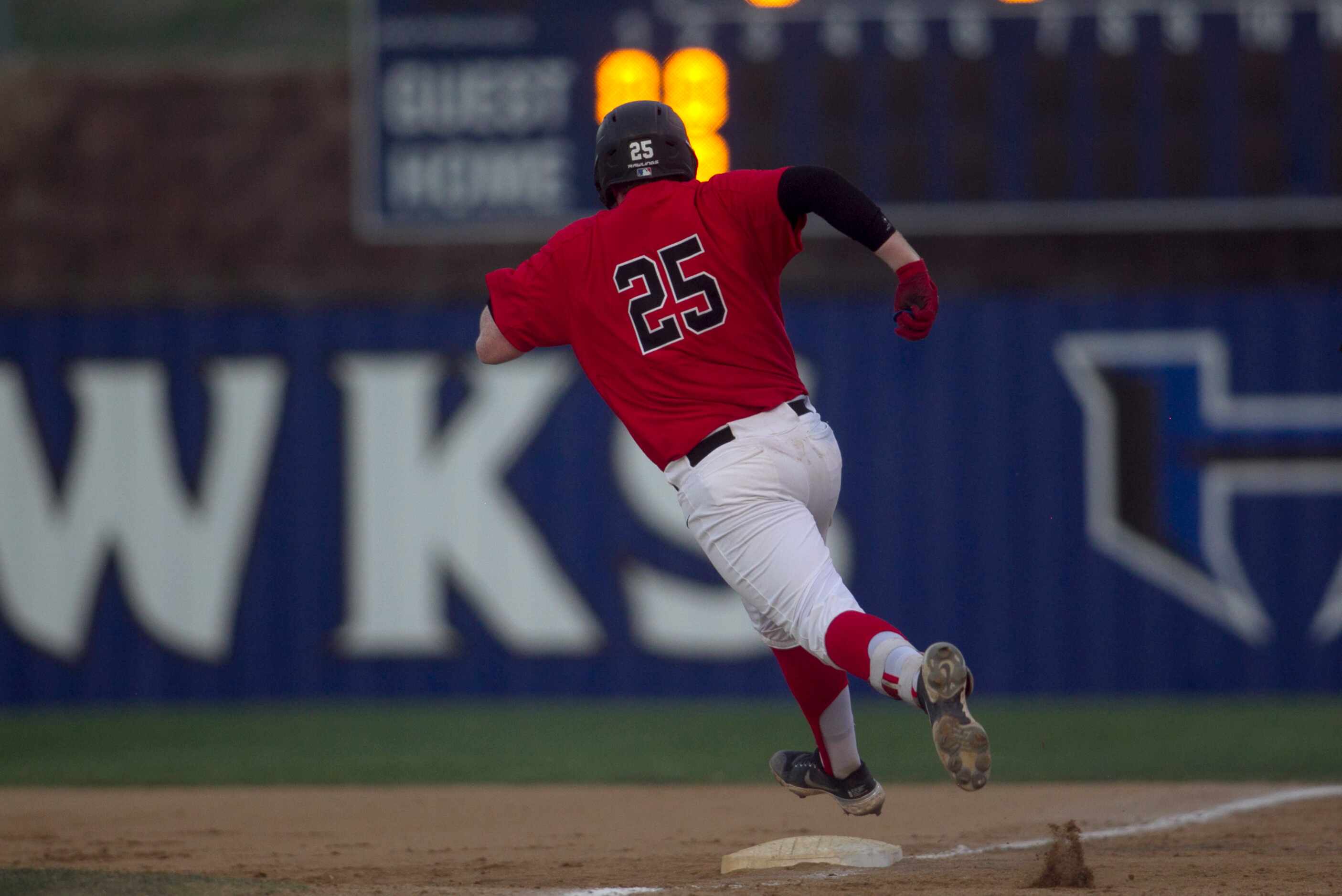 Coppell pitcher Chayton Krauss (25) rounds first base enroute as he logged a double during...