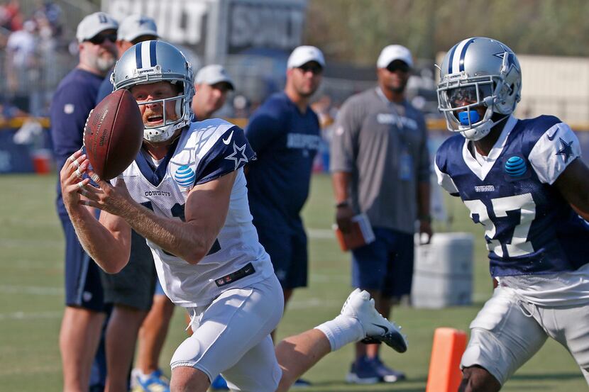 Dallas Cowboys wide receiver Cole Beasley (11) pulls in a pass over cornerback Jourdan Lewis...