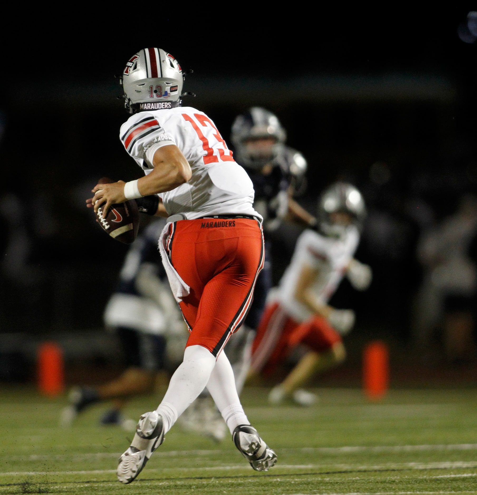 Flower Mound Marcus quarterback Colton Nussmeier (13) looks to pass during second quarter...