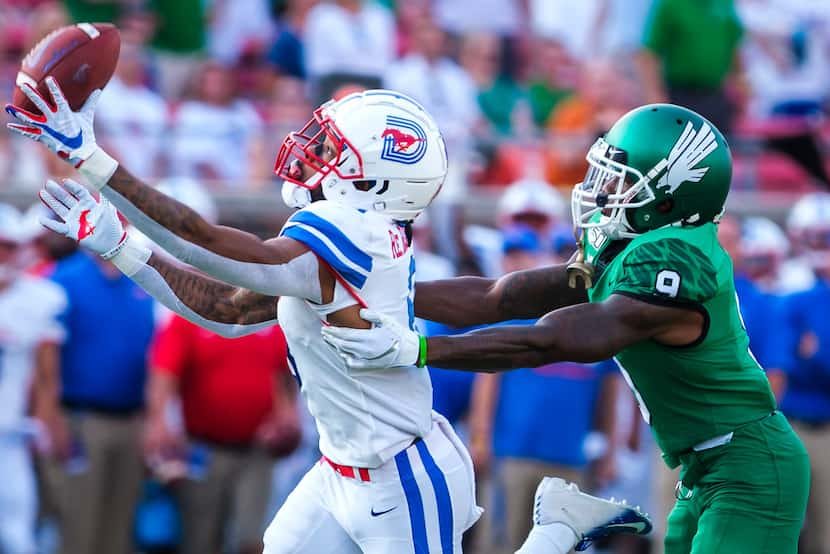 SMU wide receiver Reggie Roberson Jr. (8) has a pass go off his fingers as UNT defensive...