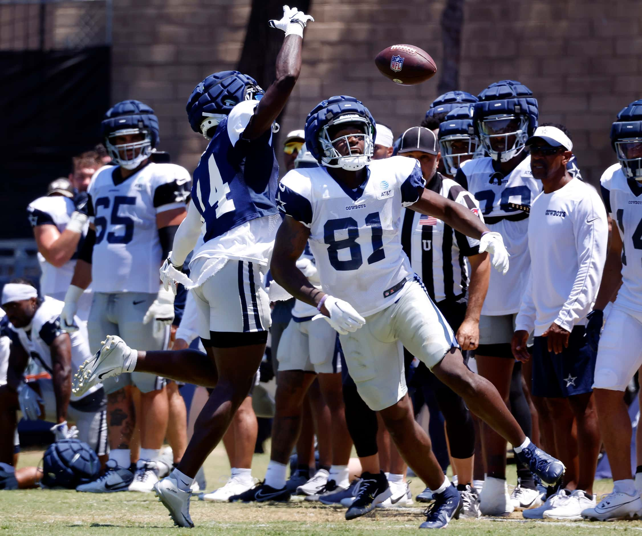 Dallas Cowboys tight end John Stephens (81) bobbles a pass as he’s covered by safety...