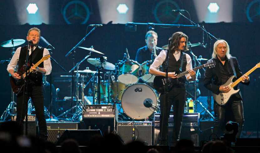 Don Henley (far left) performs with other members of the American rock band the Eagles at...