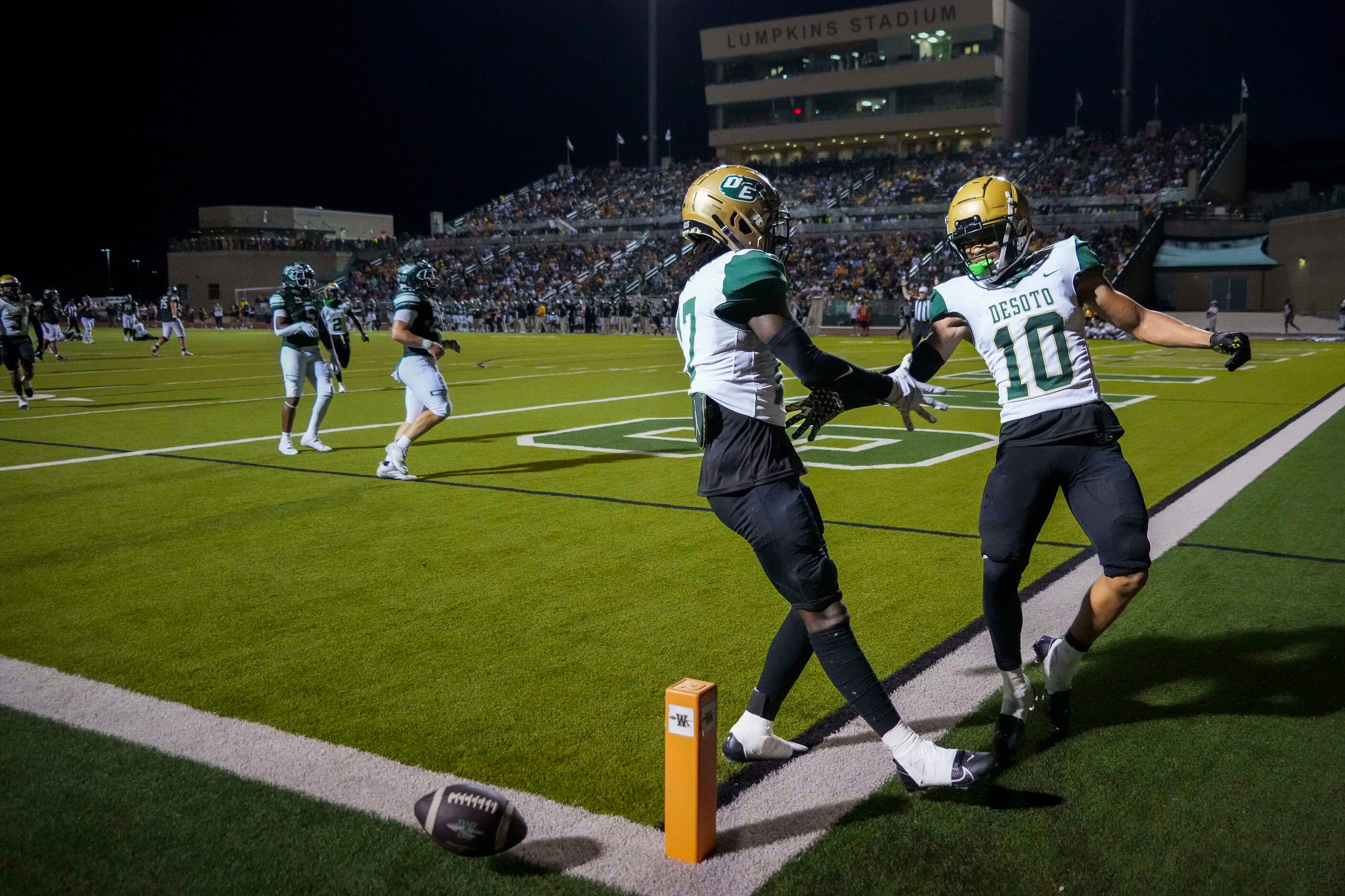 DeSoto  defensive back Sael Reyes (17) celebrates with defensive back Makali McKellar (10)...