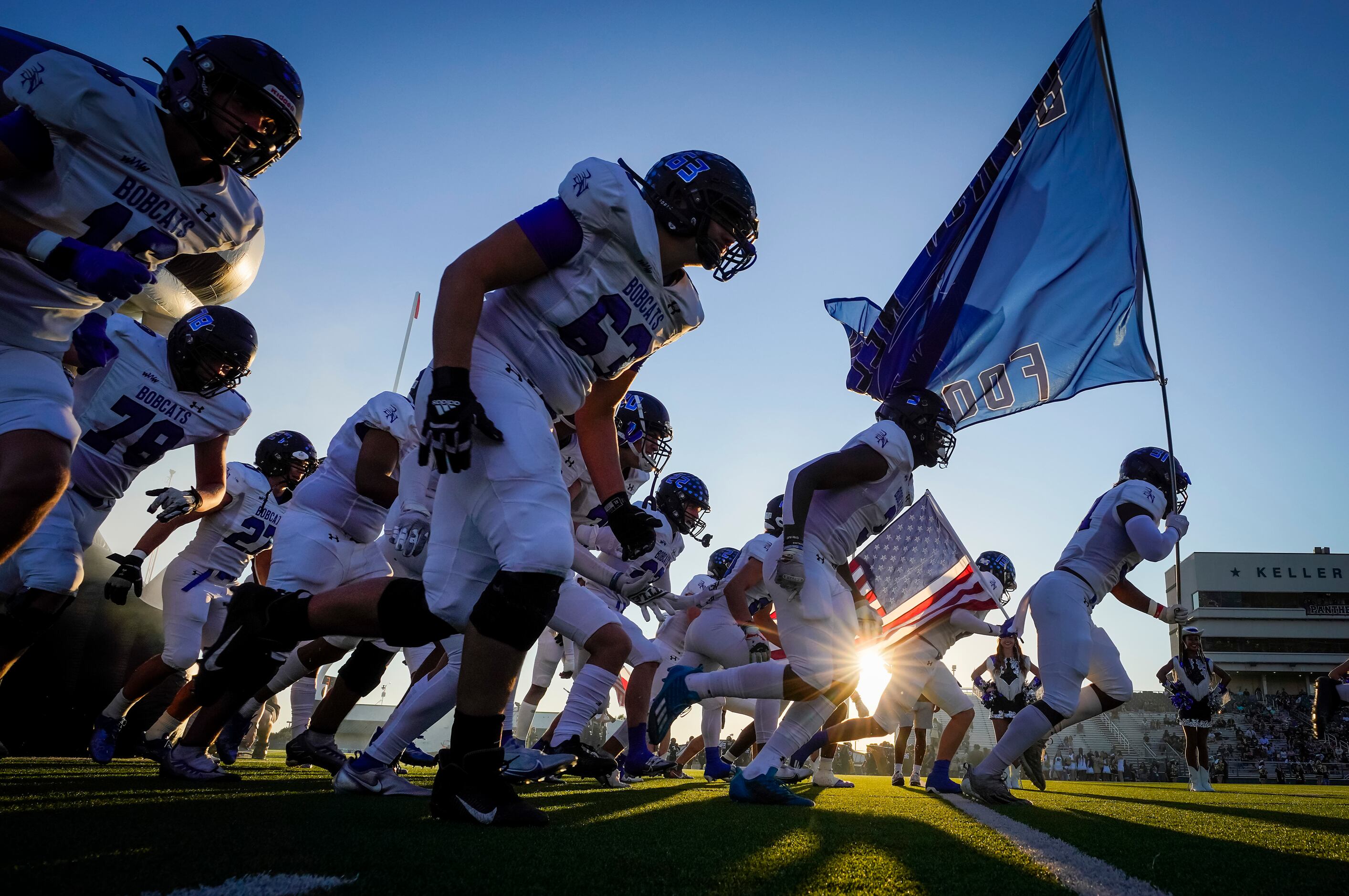 Trophy Club Byron Nelson players take the field to face Keller Fossil Ridge in a high school...