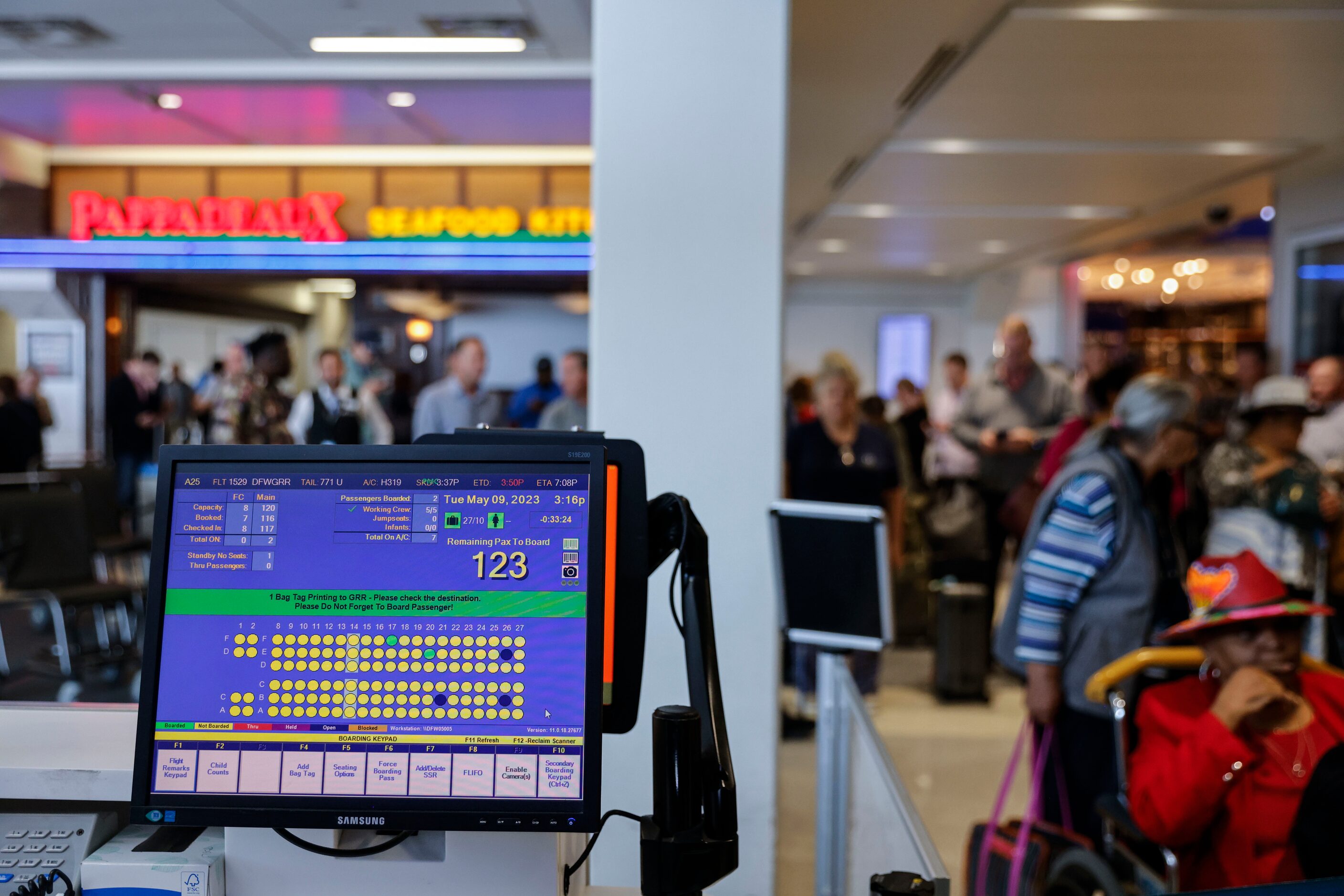 A computer screen shows the seating allocation of an American Airlines flight to Grand...