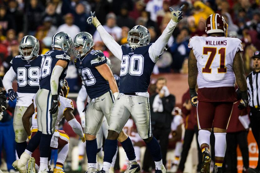 Dallas Cowboys defensive end Demarcus Lawrence (90) celebrates after a tackle during the...