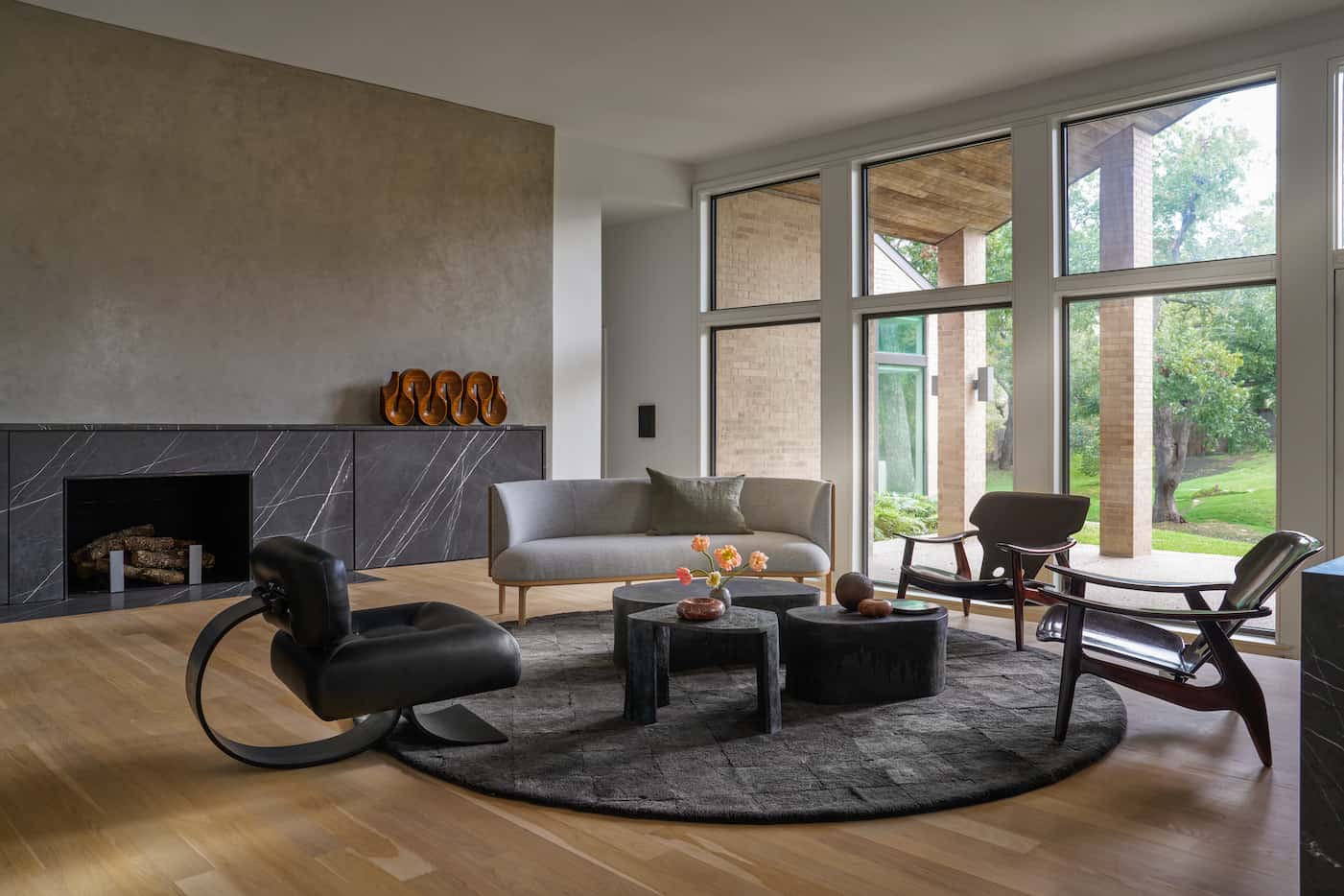In this modern living room designed by Joshua Rice, find a vintage Brazilian “Alta” lounge...