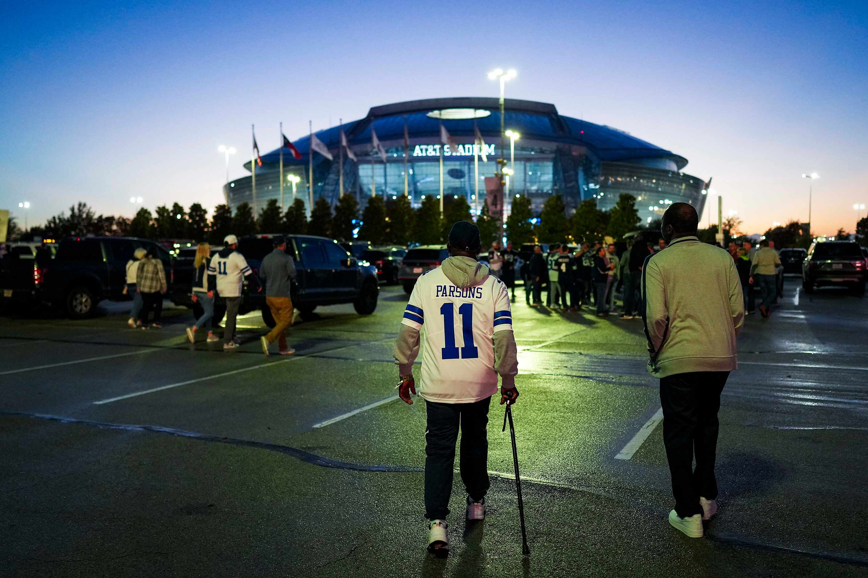 Fans head to the stadium before an NFL football game between the Dallas Cowboys and the...