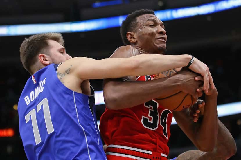 CHICAGO, IL - NOVEMBER 12:  Wendell Carter Jr. #34 of the Chicago Bulls and Luka Doncic #77...