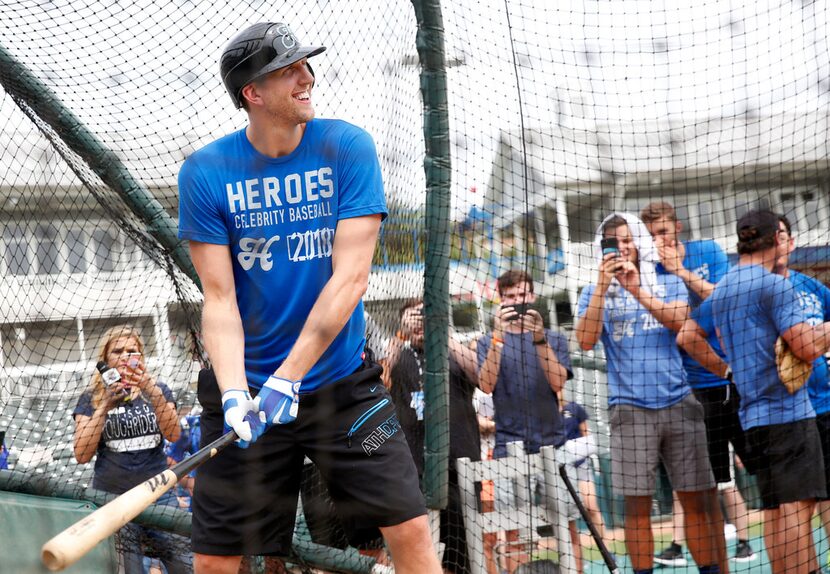 Dallas Mavericks forward Dirk Nowitzki prepares to hit a ball during batting practice for...