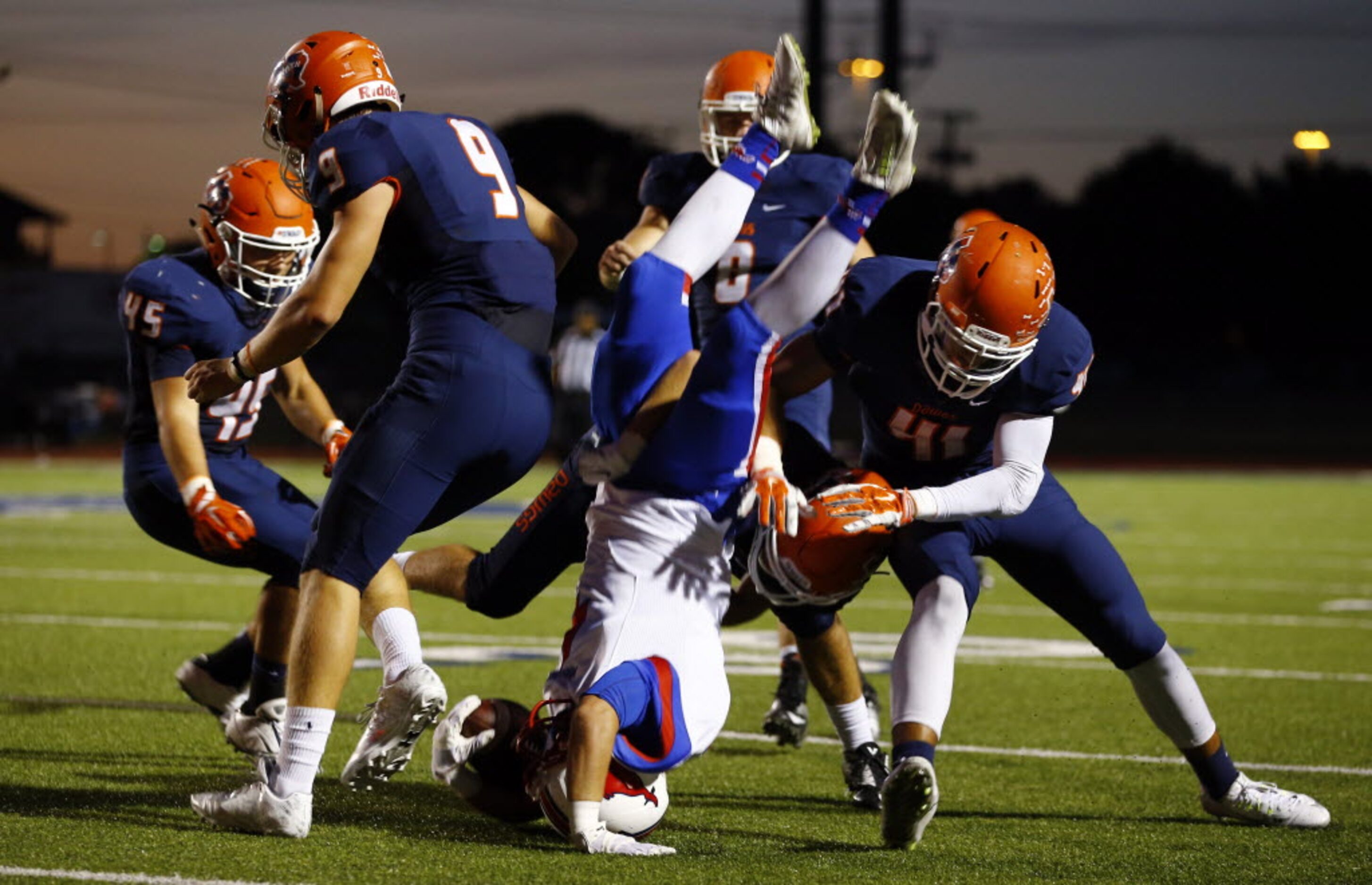 TXHSFB Richardson Pearce wide receiver Spencer Mandell (4) is tackled by McKinney North...