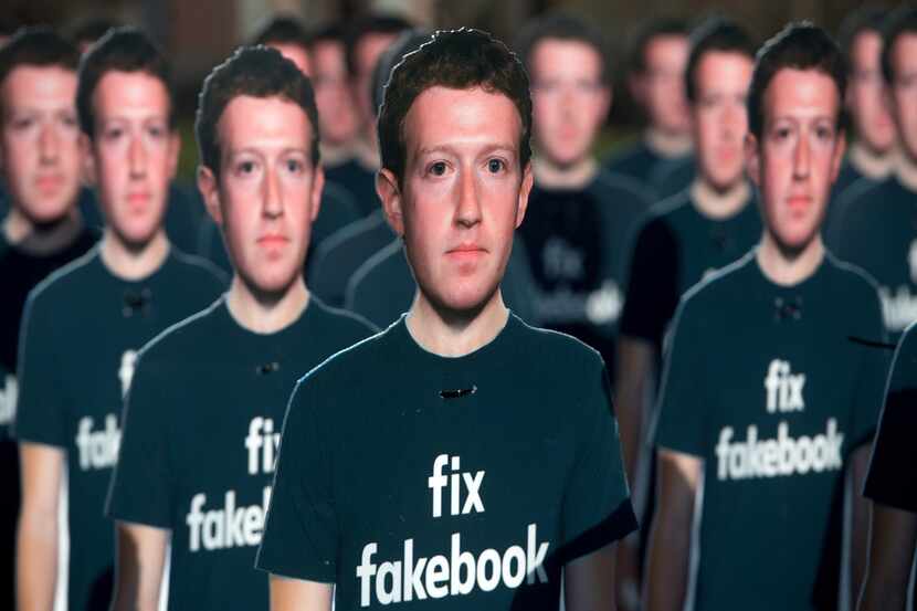 In this file photo taken on April 10, 2018, 100 cardboard cutouts of Facebook founder and...