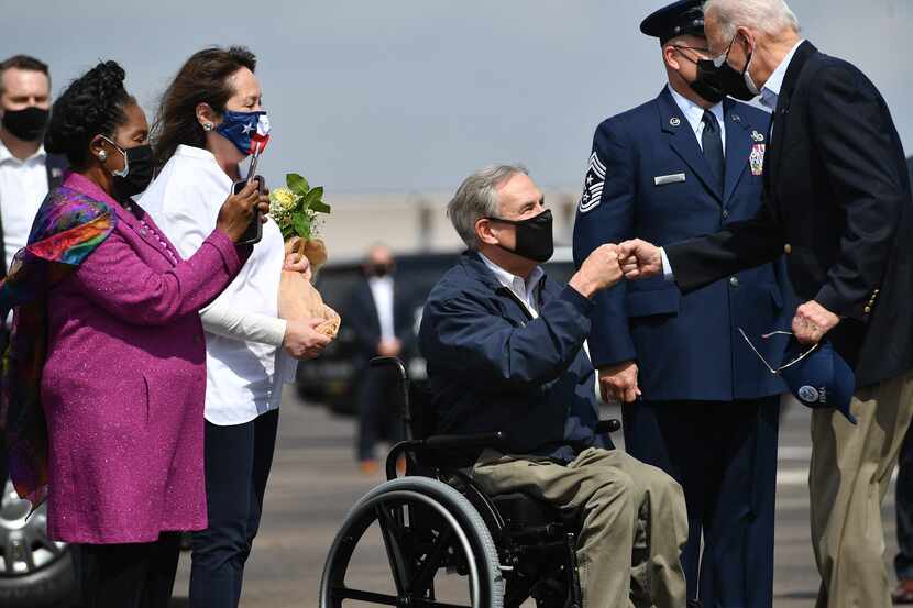 President Joe Biden greets Texas Gov.  Greg Abbott and his wife Cecilia Abbott (2nd L) at...