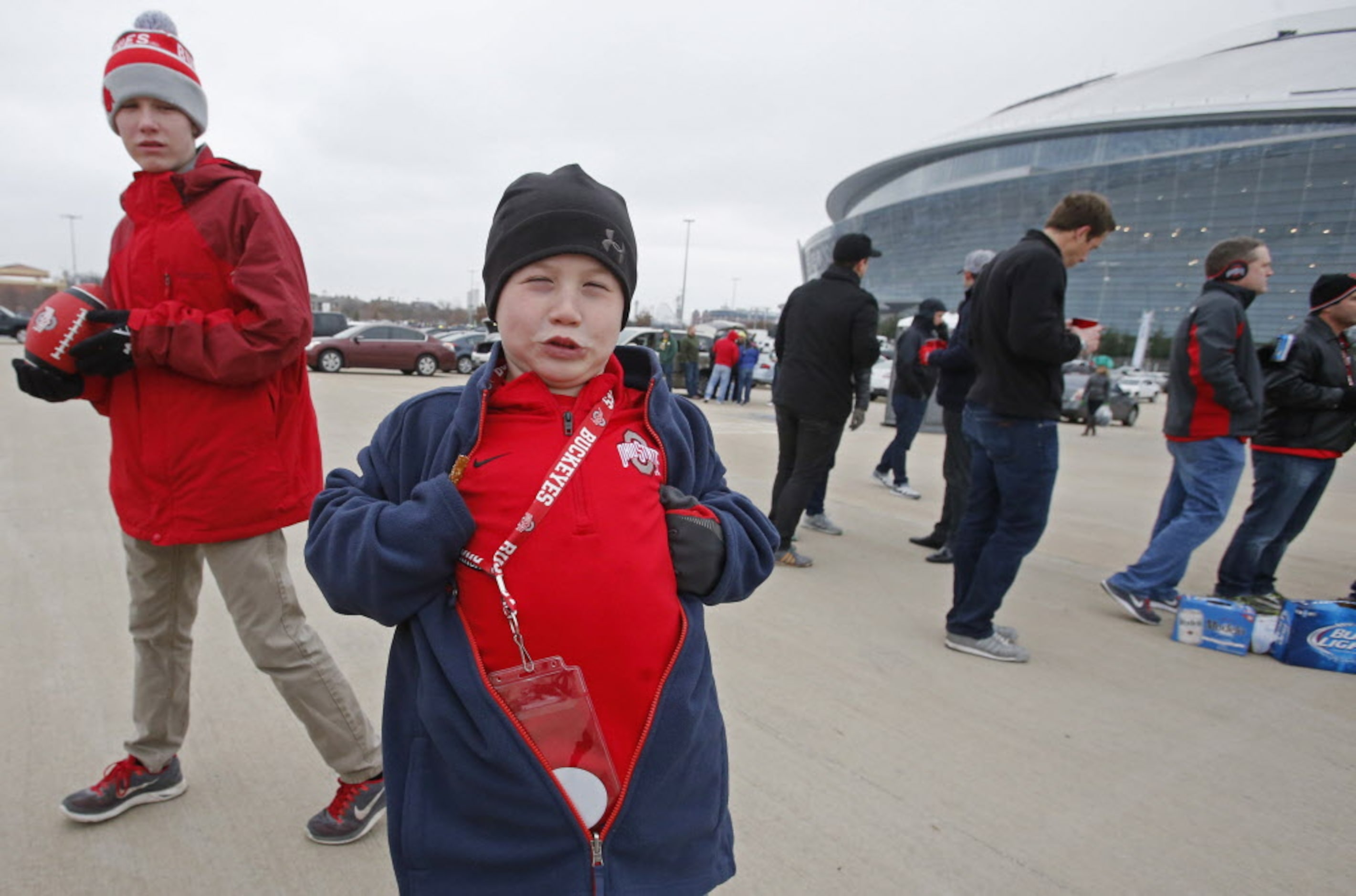 Ed Small shows off his Ohio State colors as he tailgates with family before the College...