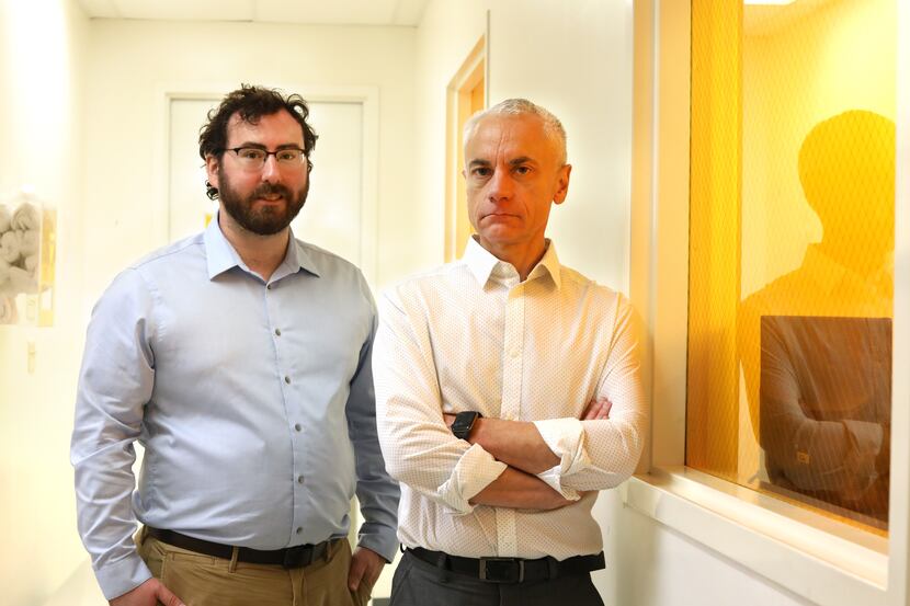 Mark Hettick, left, and Fabio Ferrari pose for a photograph at Precision BioMEMS in Addison,...