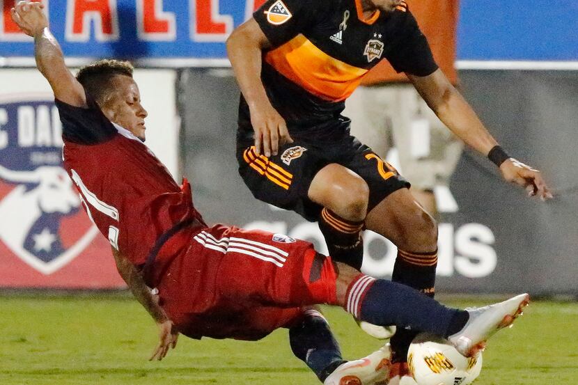 FILE - FC Dallas midfielder Michael Barrios (21) gets to the ball before Houston Dynamo...