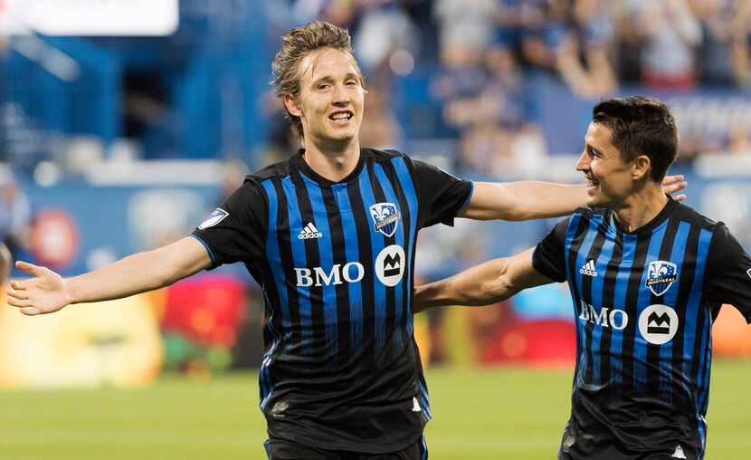 Montreal Impact's Lassi Lappalainen, left, celebrates with teammate Bojan after scoring...
