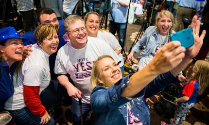 Andrea Proctor takes a selfie as supporters of a proposed new stadium for the Texas Rangers...