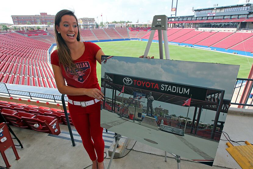 Jaclyn Seidler of FC Dallas shows a rendering at a press conference announcing the naming of...