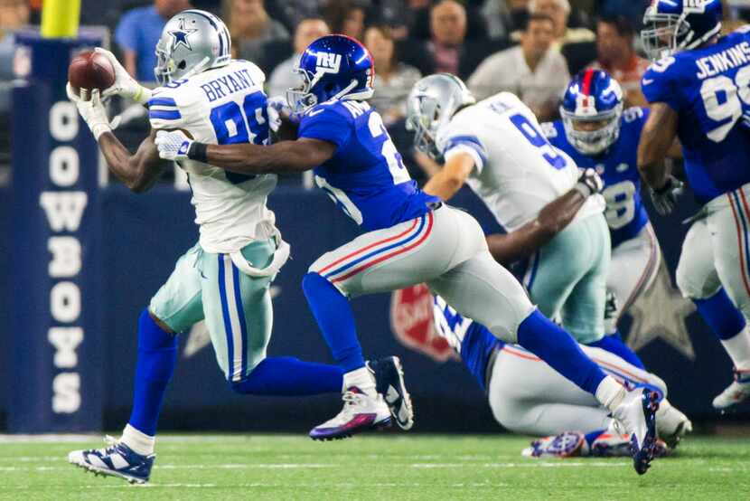 Dallas Cowboys wide receiver Dez Bryant (88) catches a pass as New York Giants cornerback...