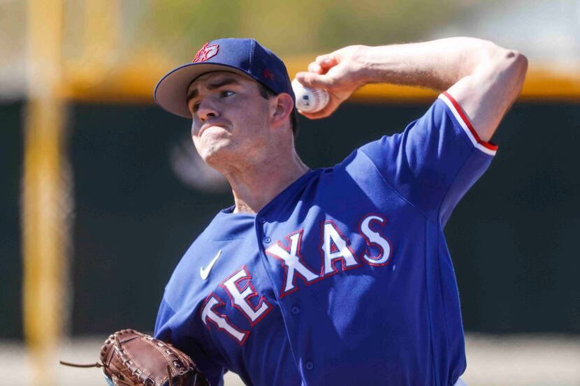 Texas Rangers pitcher Cody Bradford throws a pitch for batting practice during a spring...