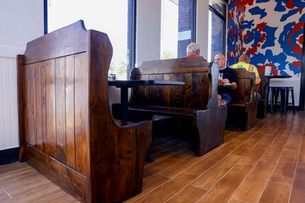 New walls, old booths: These wooden booths were brought over from the original Great...