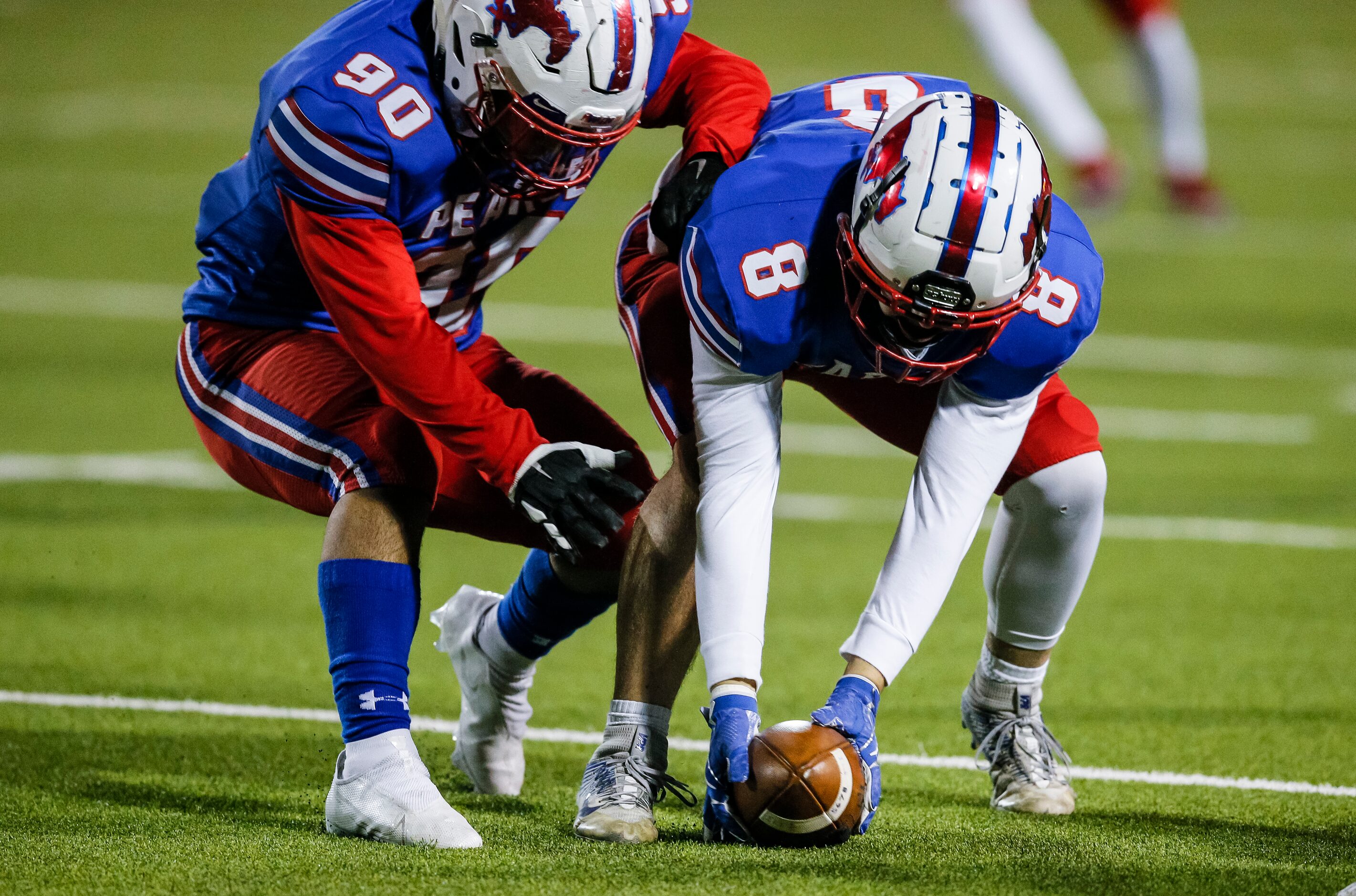 JJ Pearce sophomore defensive lineman Isaac Martinez (90) looks on as senior linebacker Sam...