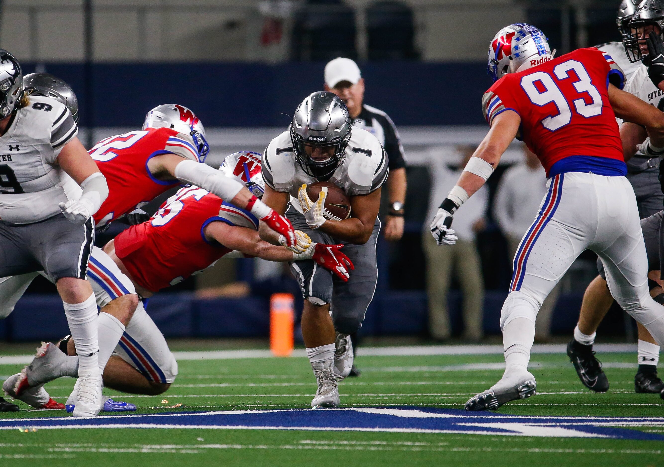 Denton Guyer's RB Kaedric Cobbs (1) tries to get past Westlake's defense in the second...